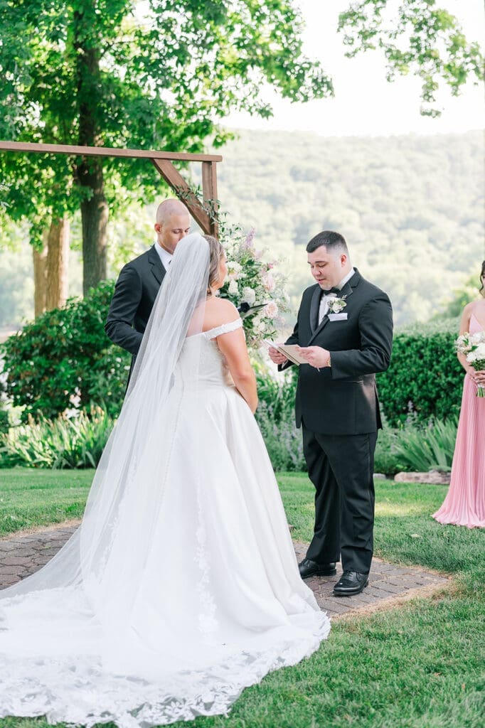 John tears up as he reads his vows. 