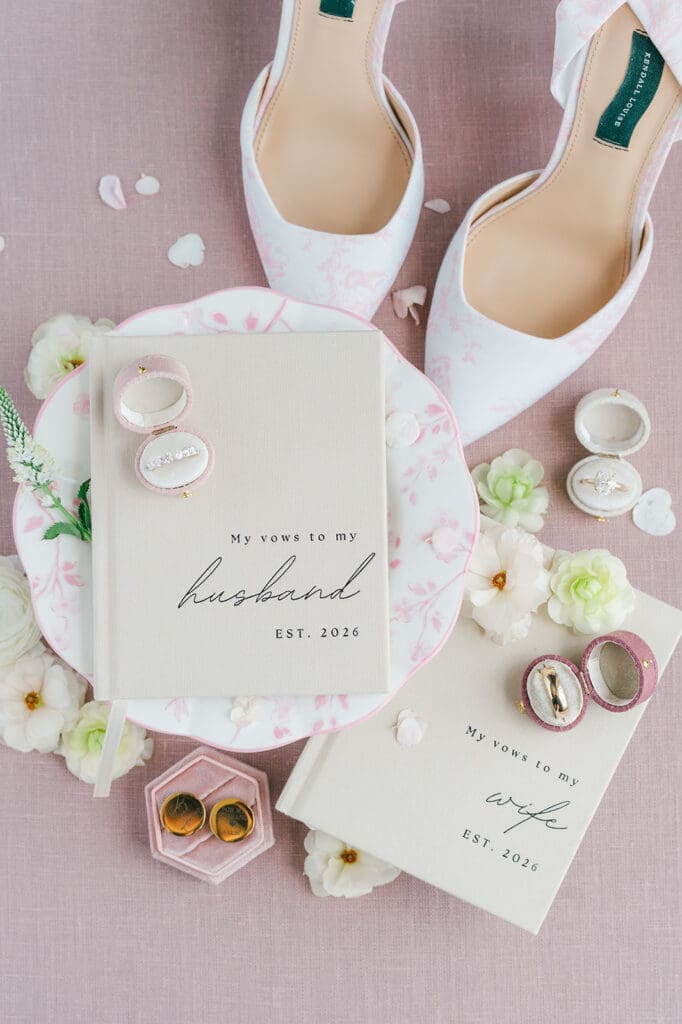 A flat lay of husband and wife wedding vow books