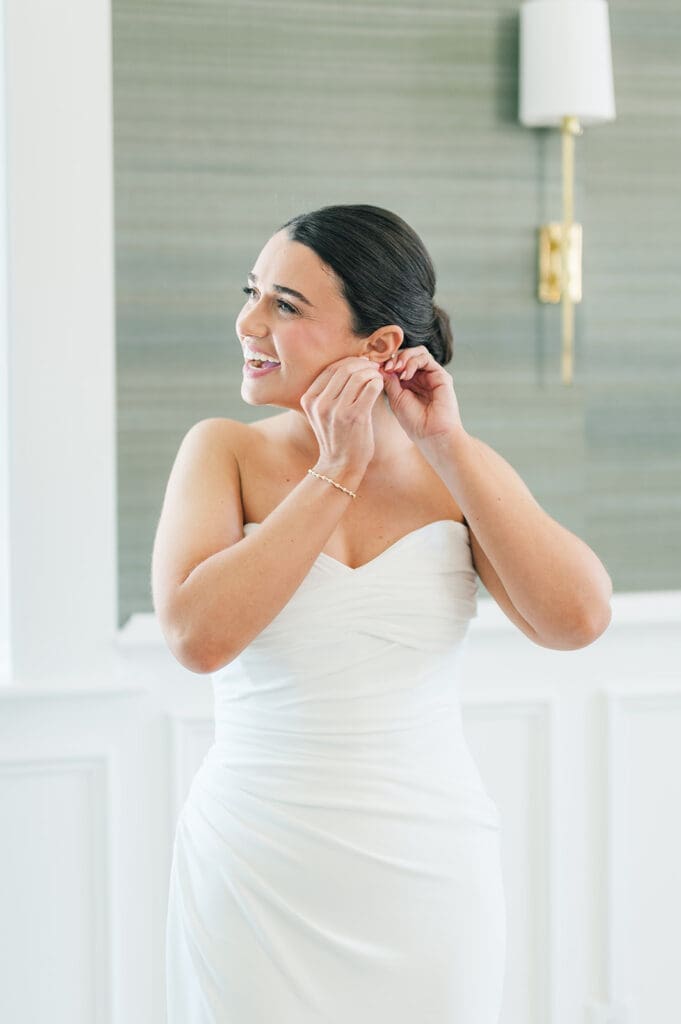 Amy puts on her earrings