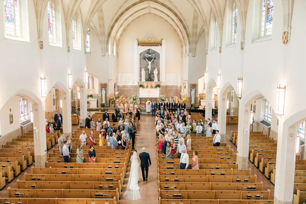 Amy walks down the aisle at her Catholic wedding ceremony
