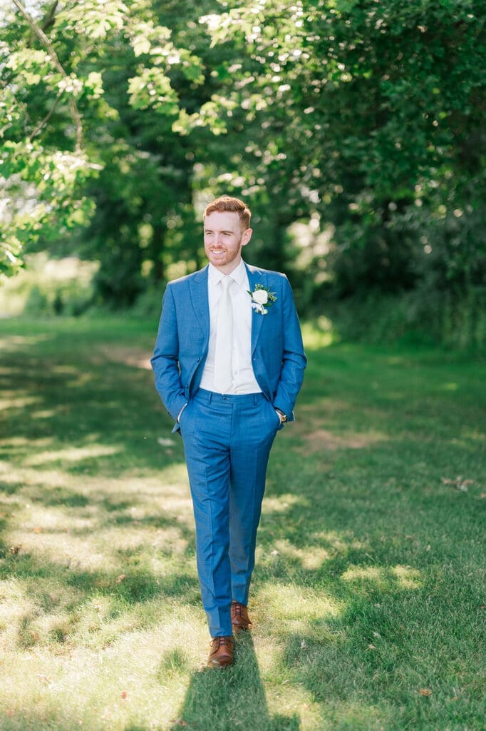 Conor walks and smiles into the distance