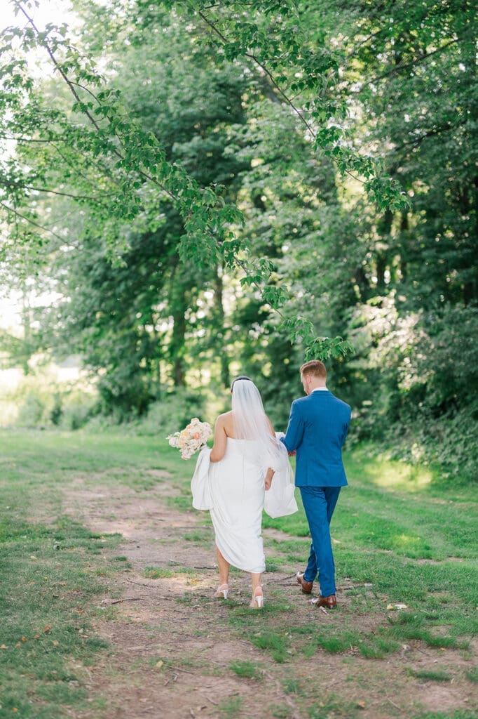 Amy and Conor walk away together towards their Wampanoag Country Club Wedding.