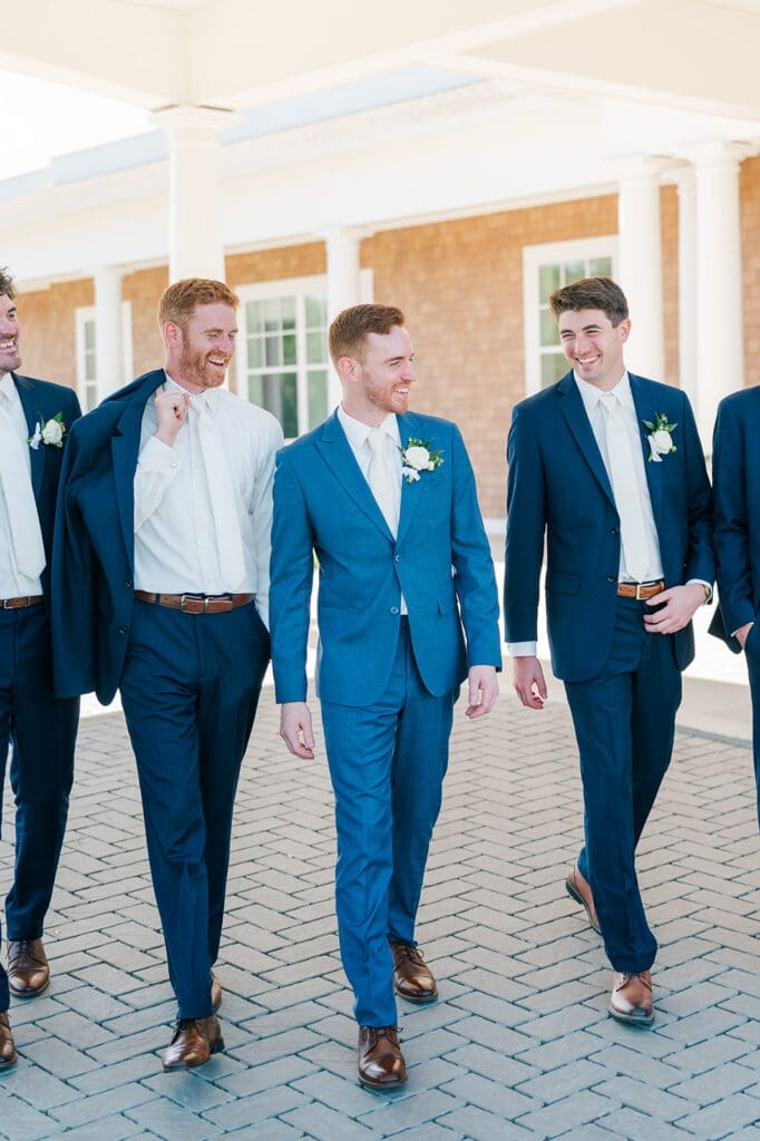 Conor and his groomsmen walk and laugh together