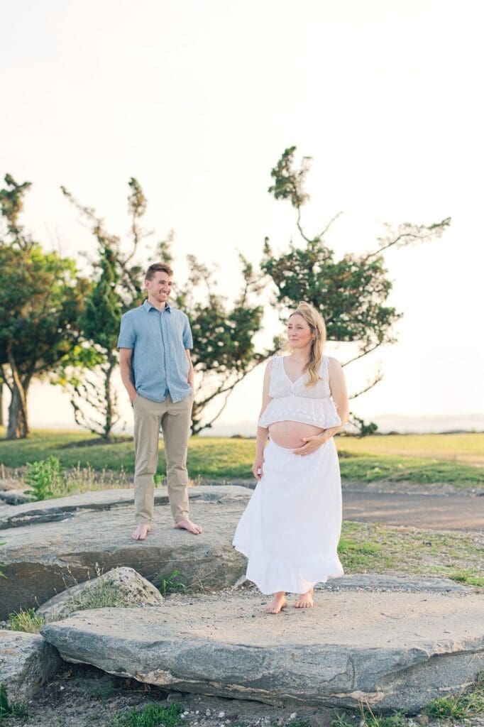Lindsey looks out into the distance as Rich smiles at her.