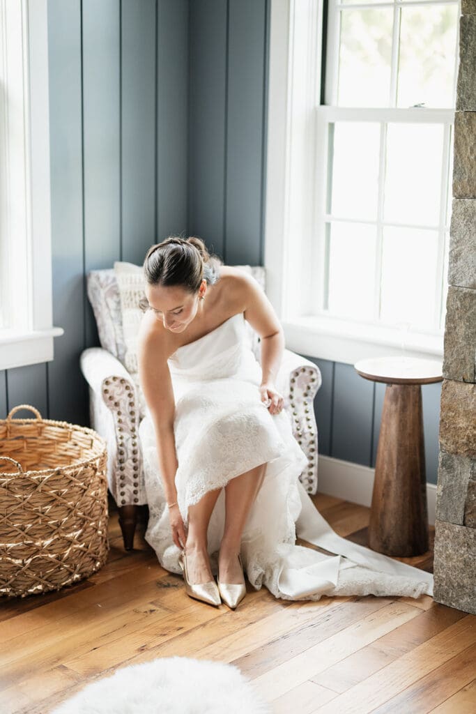 A bride puts on her shoes. 